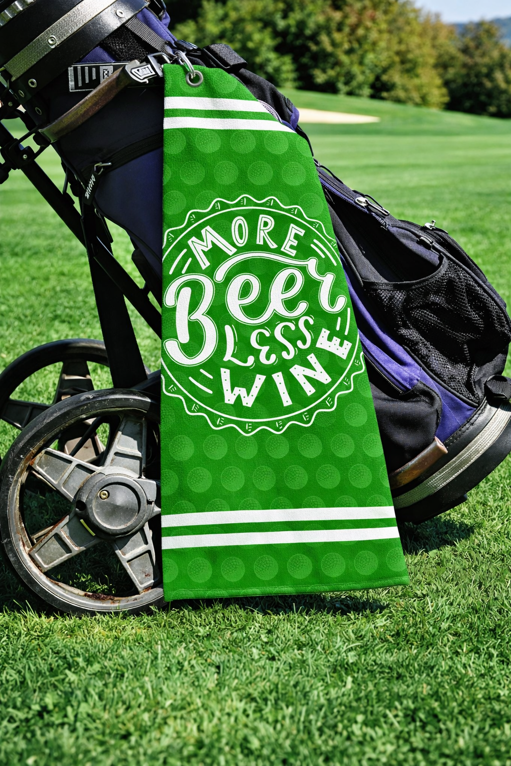 More Beer Less Wine Golf Towel – Funny 19th Hole Golf Gift – Funny beer golf towel with More Beer Less Wine design, clipped to a golf bag