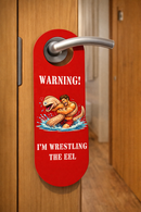 Funny Door Hanger Sign “Warning! I’m Wrestling the Eel” – Adult Humor Do Not Disturb Door Handle Sign – Novelty Bathroom or Bedroom Gag Gift Sign, Pack of 4