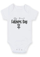 Flat mockup of the My First Father's Day design on a short-sleeve baby vest