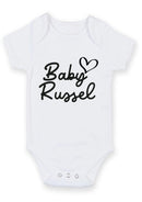 Flat mockup of the baby family name heart design on a short-sleeve baby vest