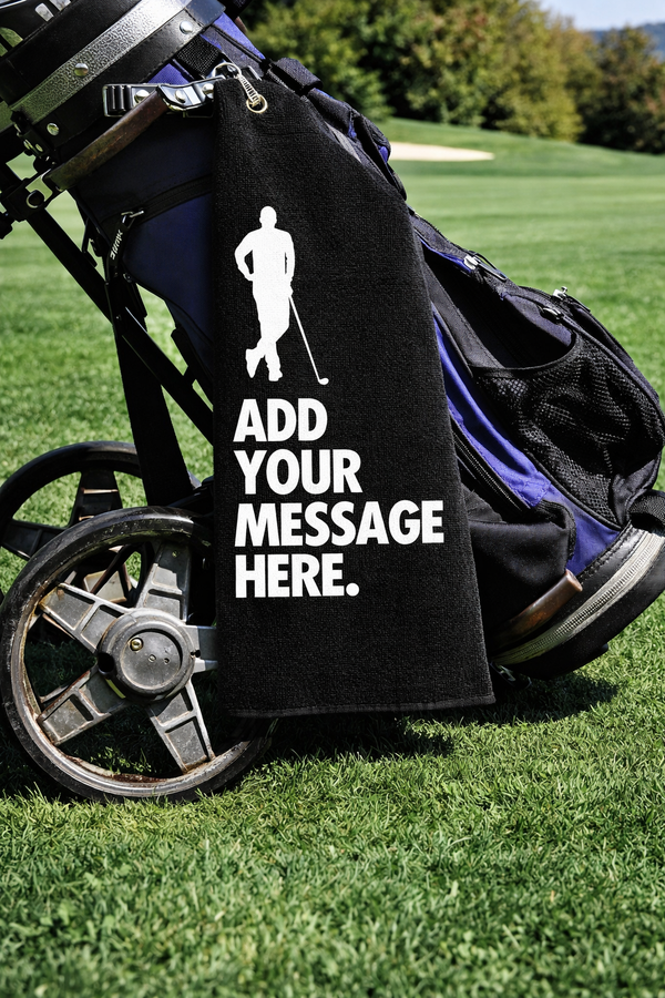 Personalised golf towel with a custom message, clipped to a golf bag