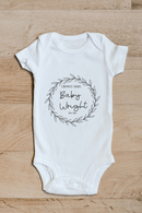 Baby coming soon flower baby grow showing the printed design on the front