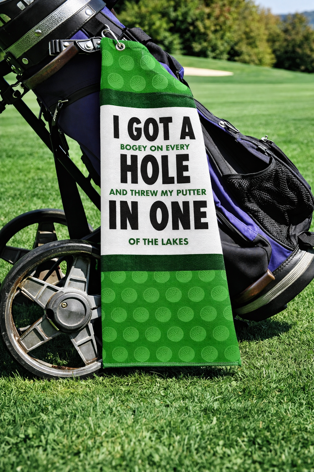 I Got a Hole in One Golf Towel – Golf Celebration Gift – Hole in one golf towel with I Got a Hole in One design, clipped to a golf bag