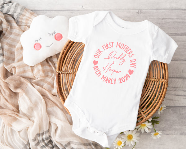 Personalised first Mother's Day baby grow with Our 1st Mother's Day Classic design in pink, printed with baby's name