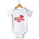 Flat mockup of the Valentine's Day design on a short-sleeve baby vest