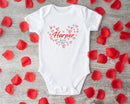 First Valentine's Day name baby grow showing the printed design on the front