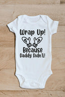 Wrap up Daddy didn't funny baby grow showing the printed design on the front