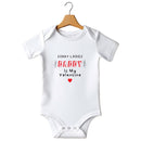 Flat mockup of the Sorry Ladies Daddy Is My Valentine design on a short-sleeve baby vest