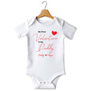 Flat mockup of the My First Valentine is my Daddy design on a short-sleeve baby vest