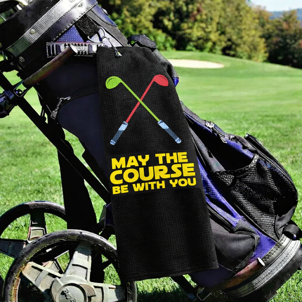 May the Course Be With You golf towel clipped to a golf bag