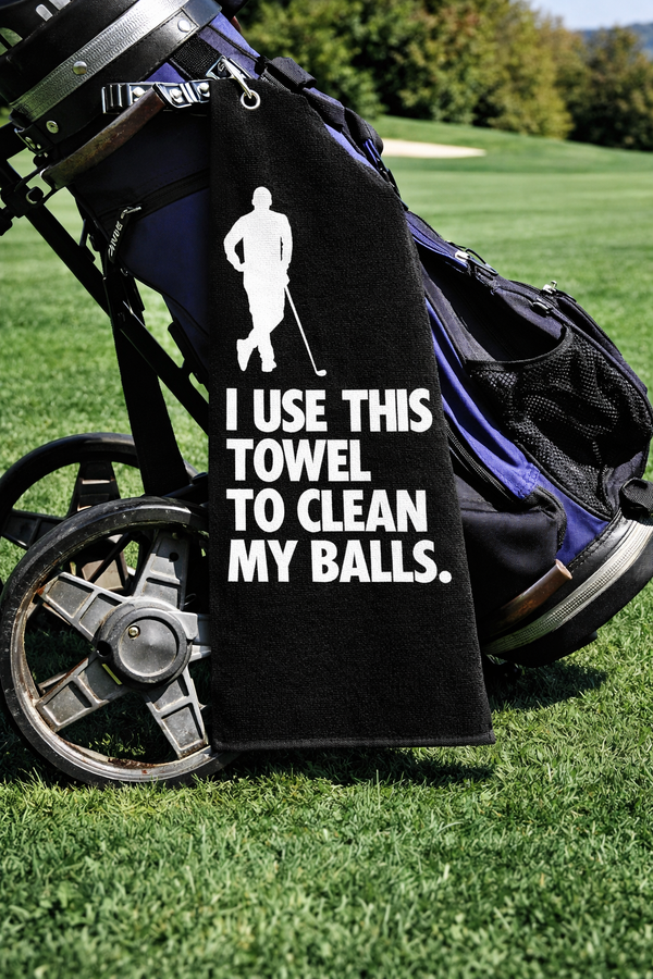 Rude Golf Towel – cheeky golf towel reading I use this towel to clean my balls, design 2, on a golf bag