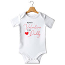 Flat mockup of the My First Valentine is my Daddy design on a short-sleeve baby vest