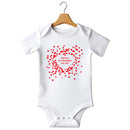 Flat mockup of the 1st Valentine's Day design on a short-sleeve baby vest