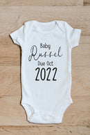 Pregnancy announcement baby grow showing the printed design on the front