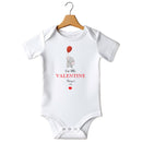 Flat mockup of the Our Little Valentine design on a short-sleeve baby vest