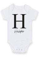 Flat mockup of the initial and name design on a short-sleeve baby vest