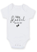 Baby due announcement baby grow with feet showing the printed design on the front