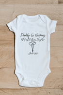 Daddy and baby first Father's Day baby grow showing the printed design on the front