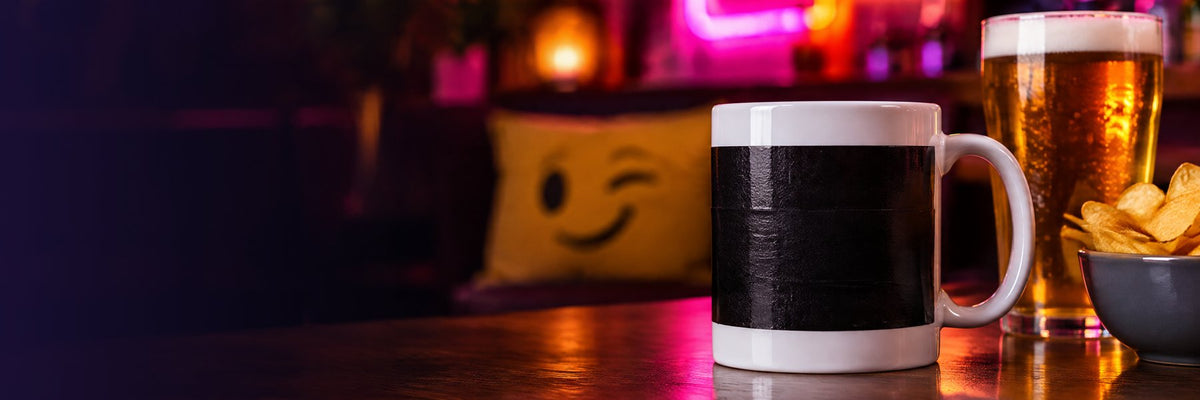 Rude adult mugs banner: a censored mug with a pint and crisps in a pub
