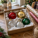 Personalised name baubles in red, gold, silver, clear and green in a gift box