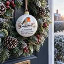 Memorial robin bauble hanging on a winter wreath on a front door
