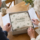 Personalised baby blanket with the name Freddie unwrapped as a new baby gift