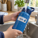 Waterproof kids name label with the name Jack staying put on a bottle at the sink