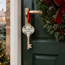 Personalised Santa's magic key hanging on a front door handle on Christmas Eve