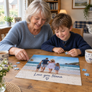 Grandmother and grandson completing a personalised photo card jigsaw at the dining table