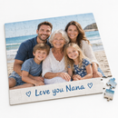 Personalised photo card jigsaw with a family beach photo and the message Love you Nana