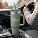 Personalised 40oz tumbler with handle with the name Olivia in a car cup holder