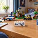 Custom printed building brick with the name Harry on a child's desk