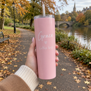Personalised 20oz skinny tumbler with the name Grace held on an autumn park walk