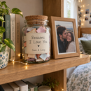Personalised reasons I love you jar on a bedroom shelf with fairy lights