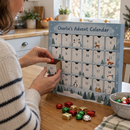 Parent filling a fill-your-own personalised advent calendar