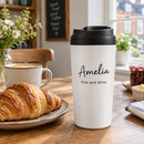 Personalised travel coffee cup with the name Amelia on a kitchen table at breakfast
