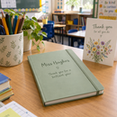 Personalised A5 notebook teacher gift on a classroom desk