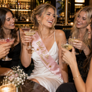 Bride-to-be wearing a personalised party sash on her hen night
