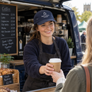 Coffee van owner wearing a personalised cap printed with her business name