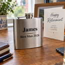 Personalised hip flask with the name James at a retirement celebration