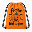 Personalised trick or treat bag in orange with a pumpkin and the name Freddie