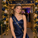 Teenager at her school prom wearing a personalised party sash