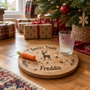 Personalised Christmas Eve board on Christmas morning under the tree