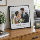 Personalised square photo slate, a large 30x30cm version leaning against a wall on a wooden sideboard in a modern UK home