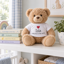 Personalised teddy bear with t-shirt on a nursery shelf