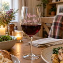 Personalised wine glass with the name Mum with red wine at a candlelit dinner