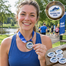 Printed medal inserts on a runner's medal after a fun run