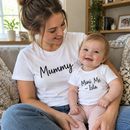 Mum and baby in personalised Mummy and Me matching t-shirts on a sofa