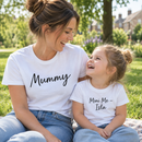 Mum and daughter wearing personalised Mummy and Me matching t-shirts in a park