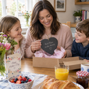 Mum opening a personalised Mum slate heart gift on Mother's Day